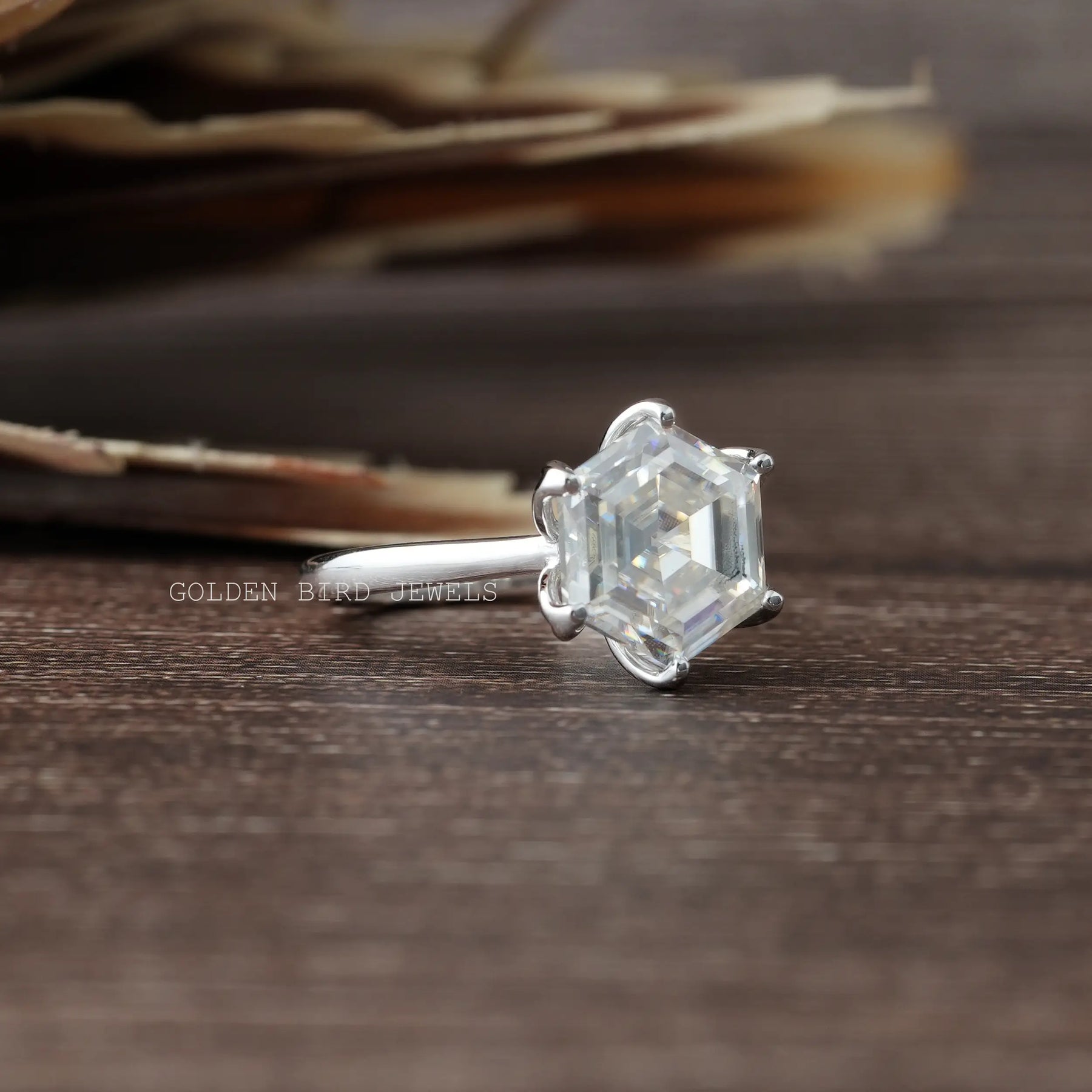 View of Moissanite Hexagon Cut Solitaire Engagement Ring In Finger