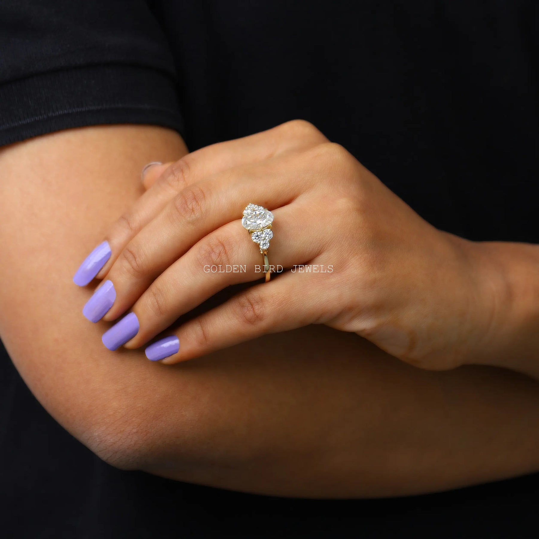 In Finger Side View Of Oval Cut Moissanite Cluster Ring
