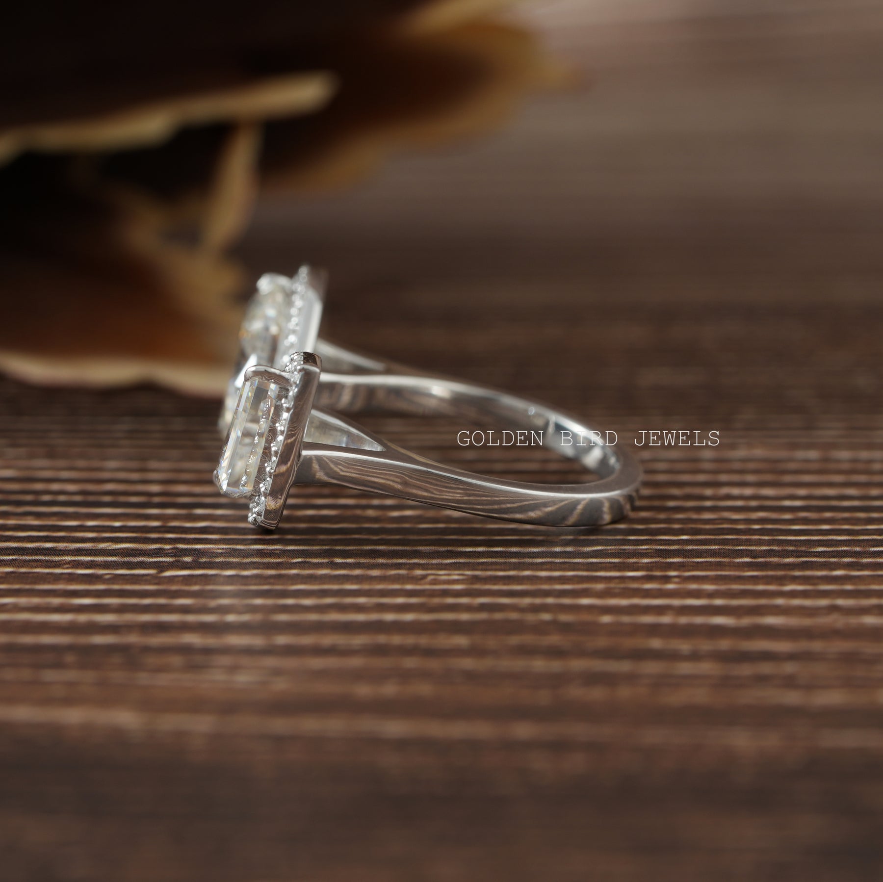 Marquies and pear cut moissanite engagement ring in a secure setting