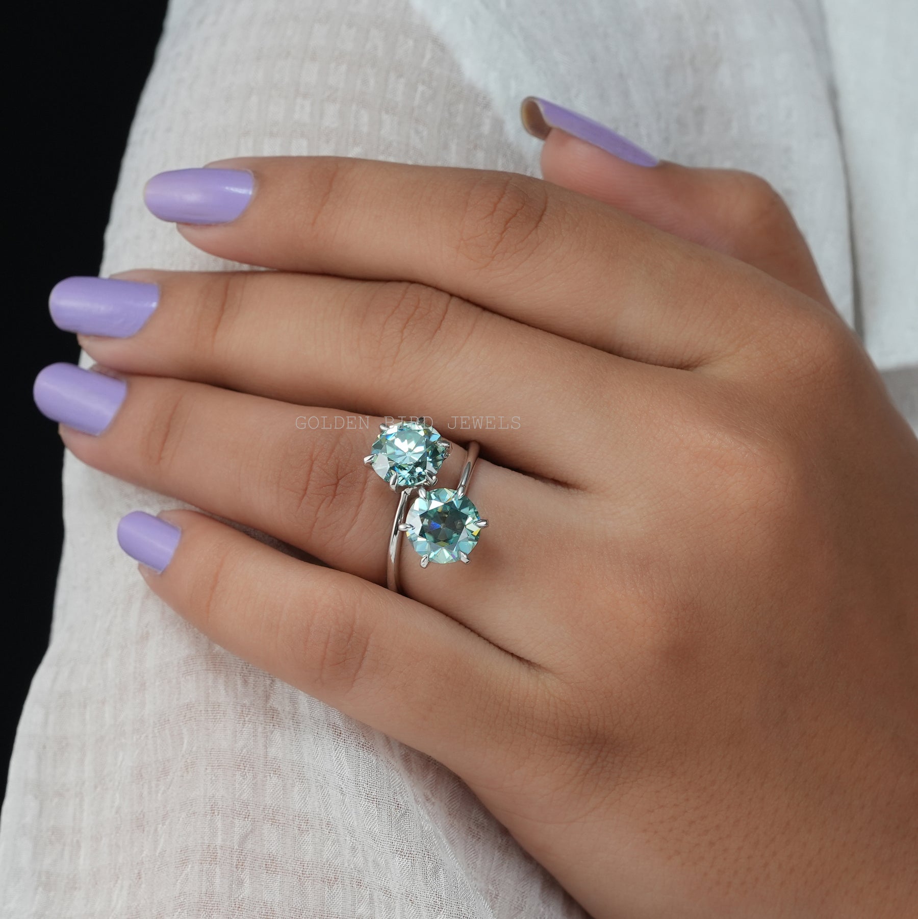 In Finger view of two stone moissanite ring
