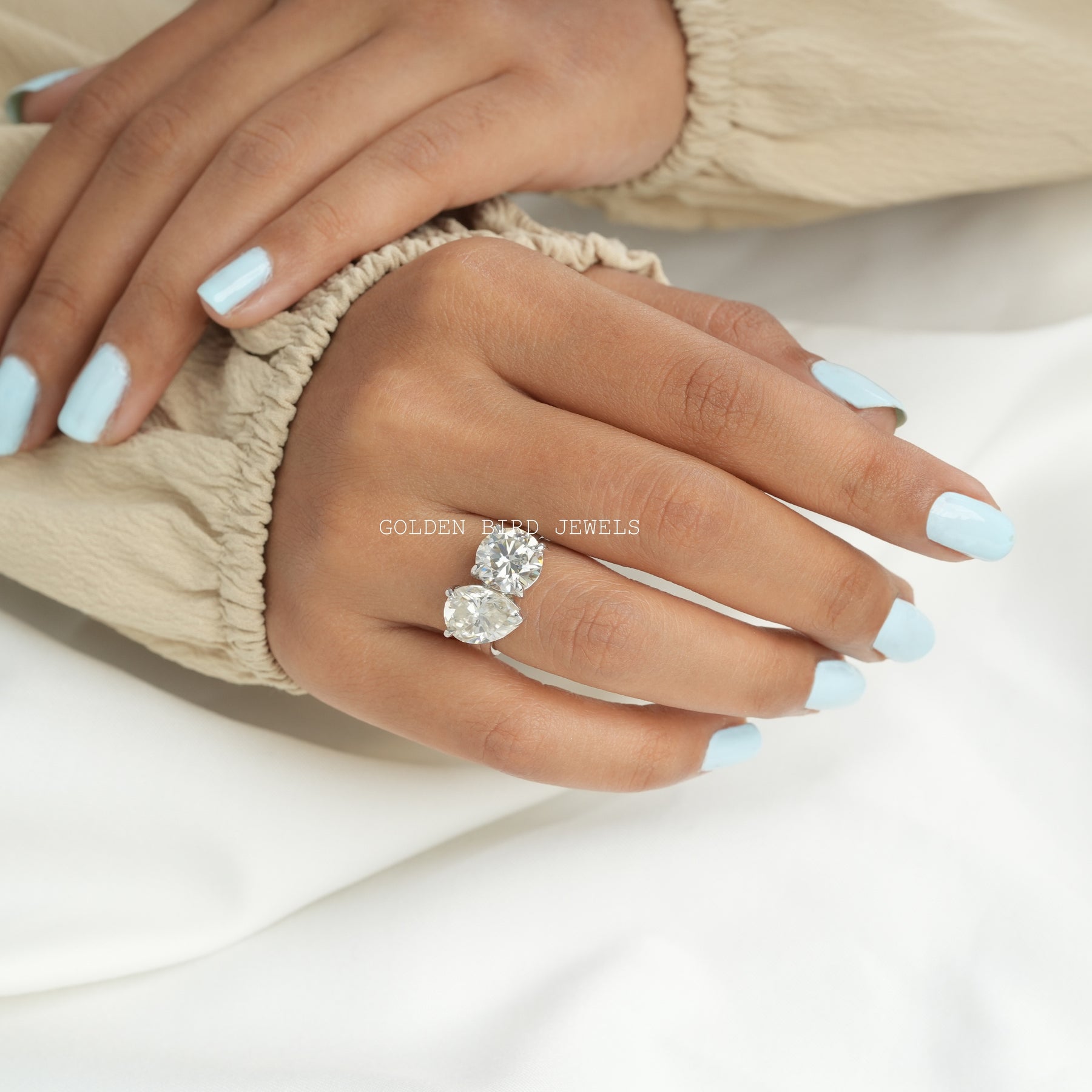 View of Round Cut Moissanite Toi Et Moi Ring In White Gold