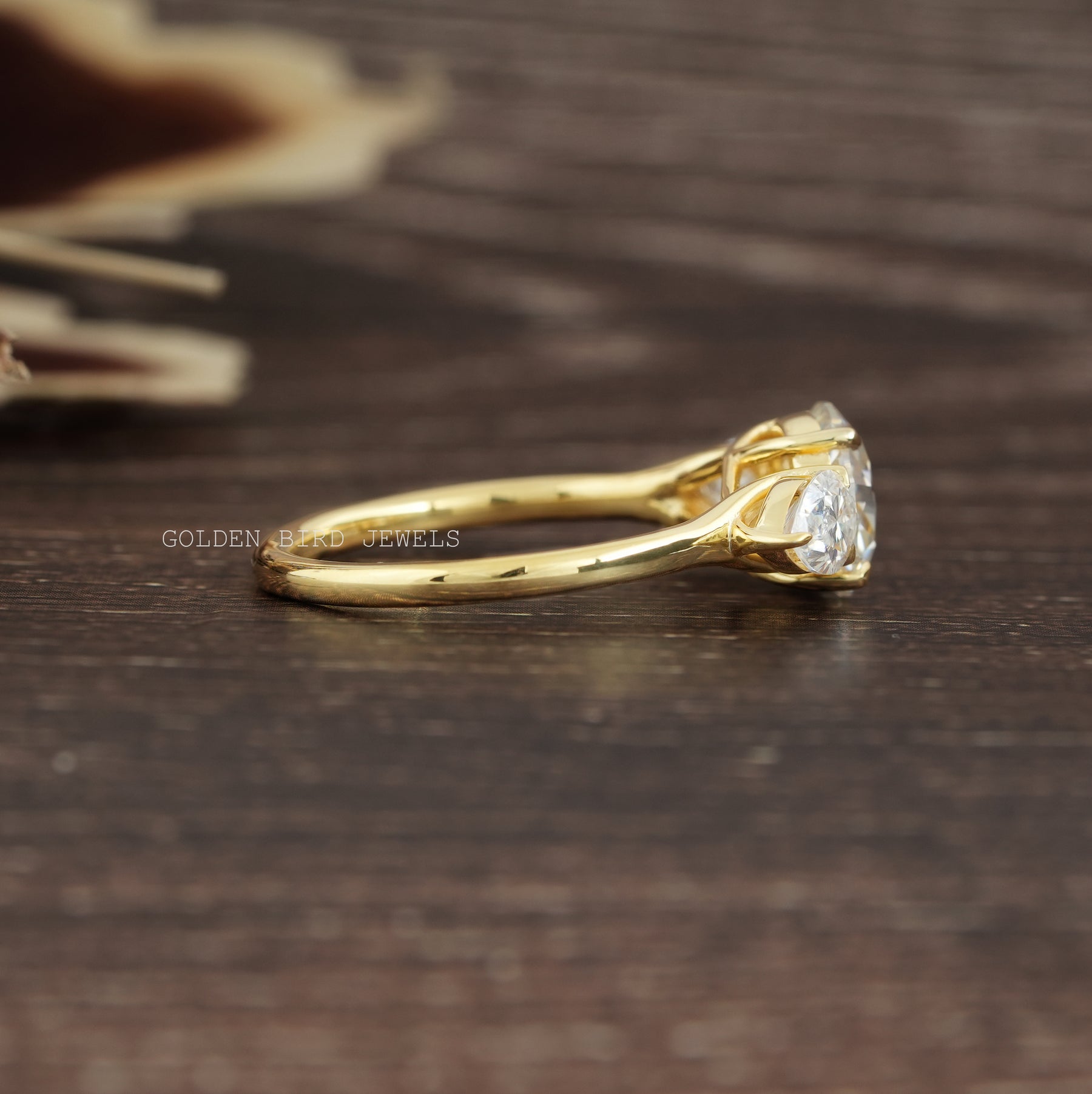 Round Cut Moissanite 3 Stone Ring In Yellow Gold