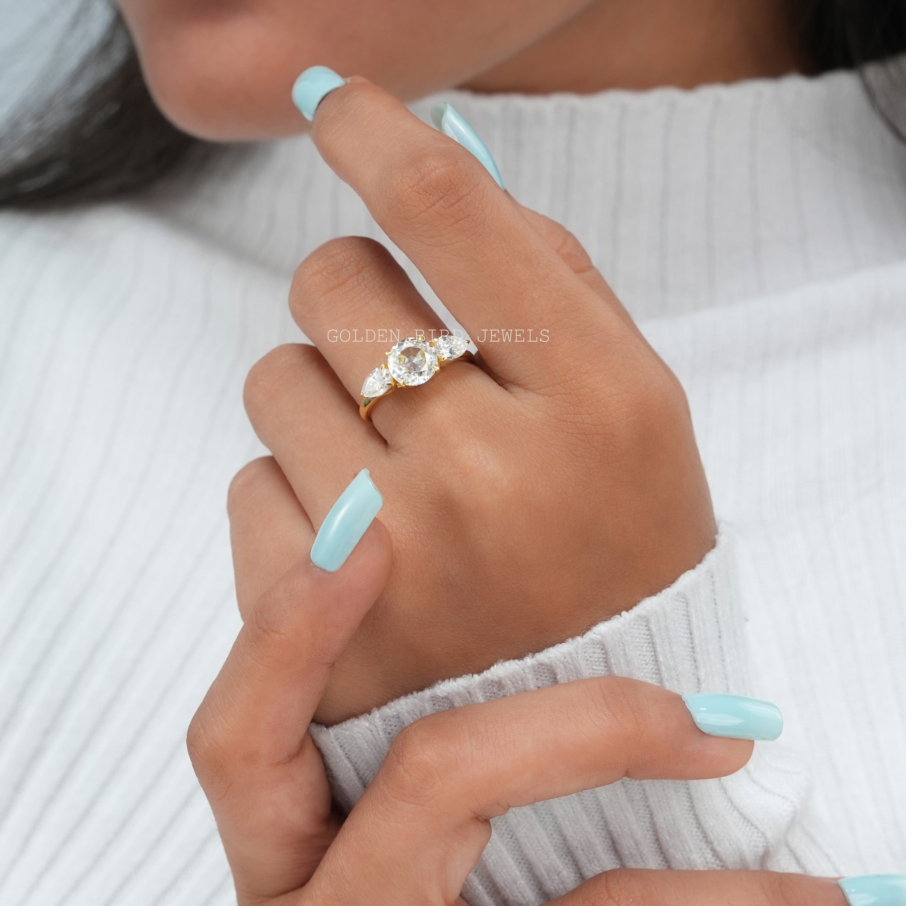 View of Round And Pear Cut Moissanite Ring In 14K Yellow Gold