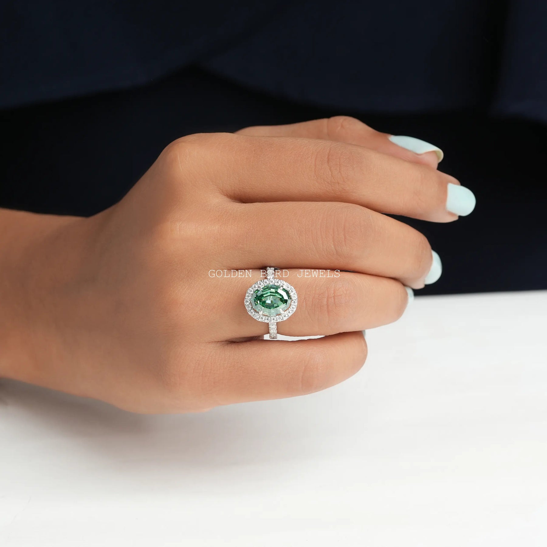 Front view of Halo Style Step Cut Oval Moissanite Engagement Ring