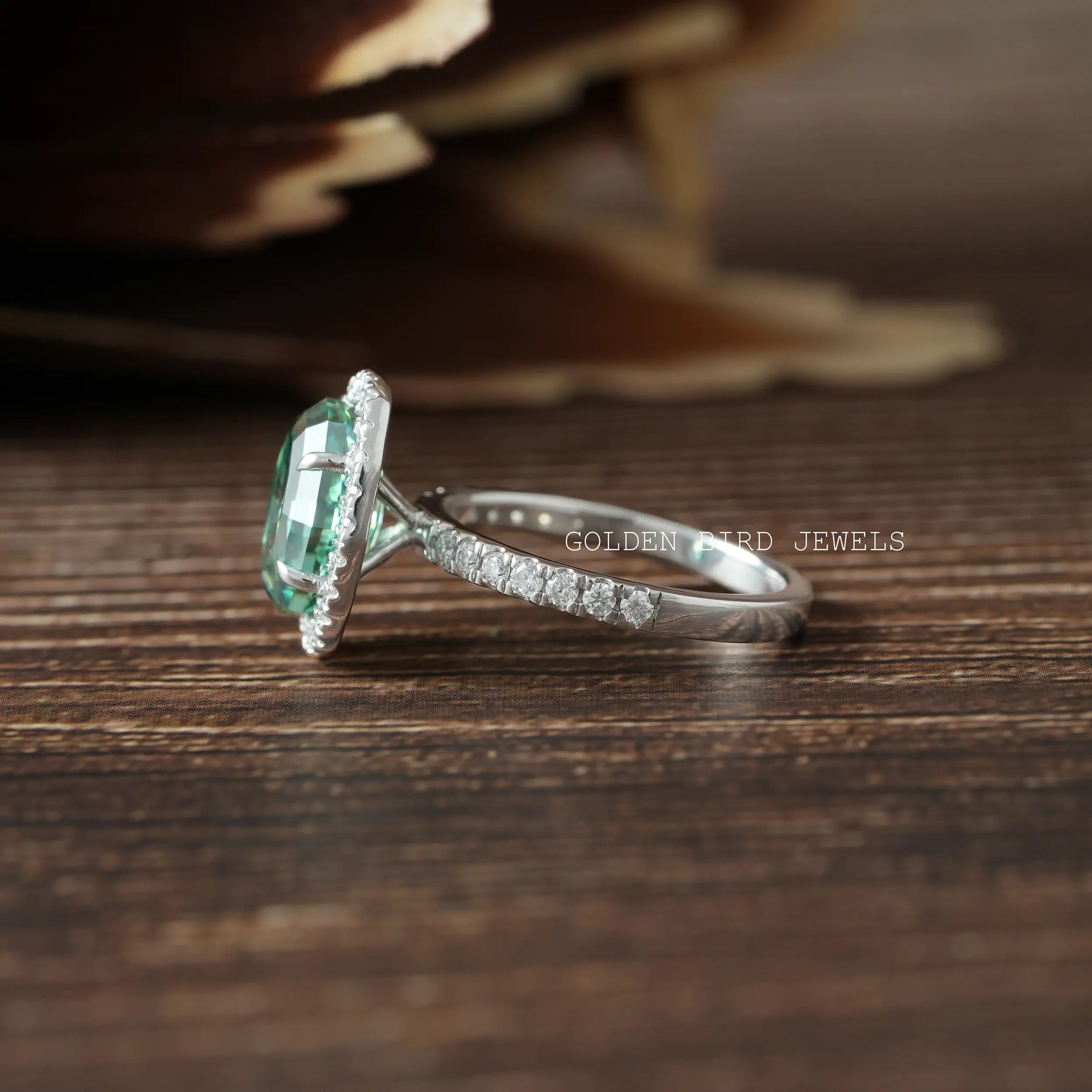Oval Halo Engagement Ring in Round Cut Side Stones