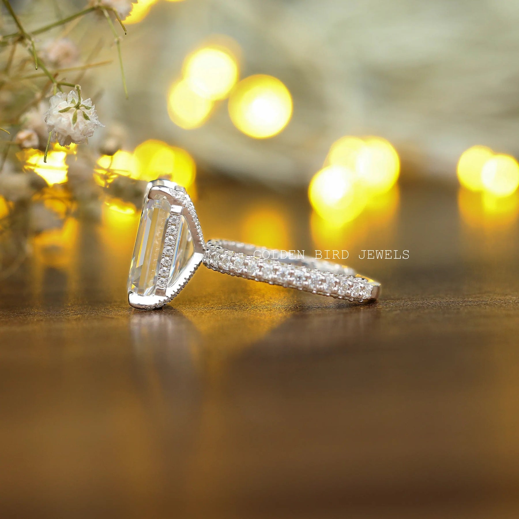 View of Emerald Cut Moissanite Hidden Halo Engagement Ring In White Gold