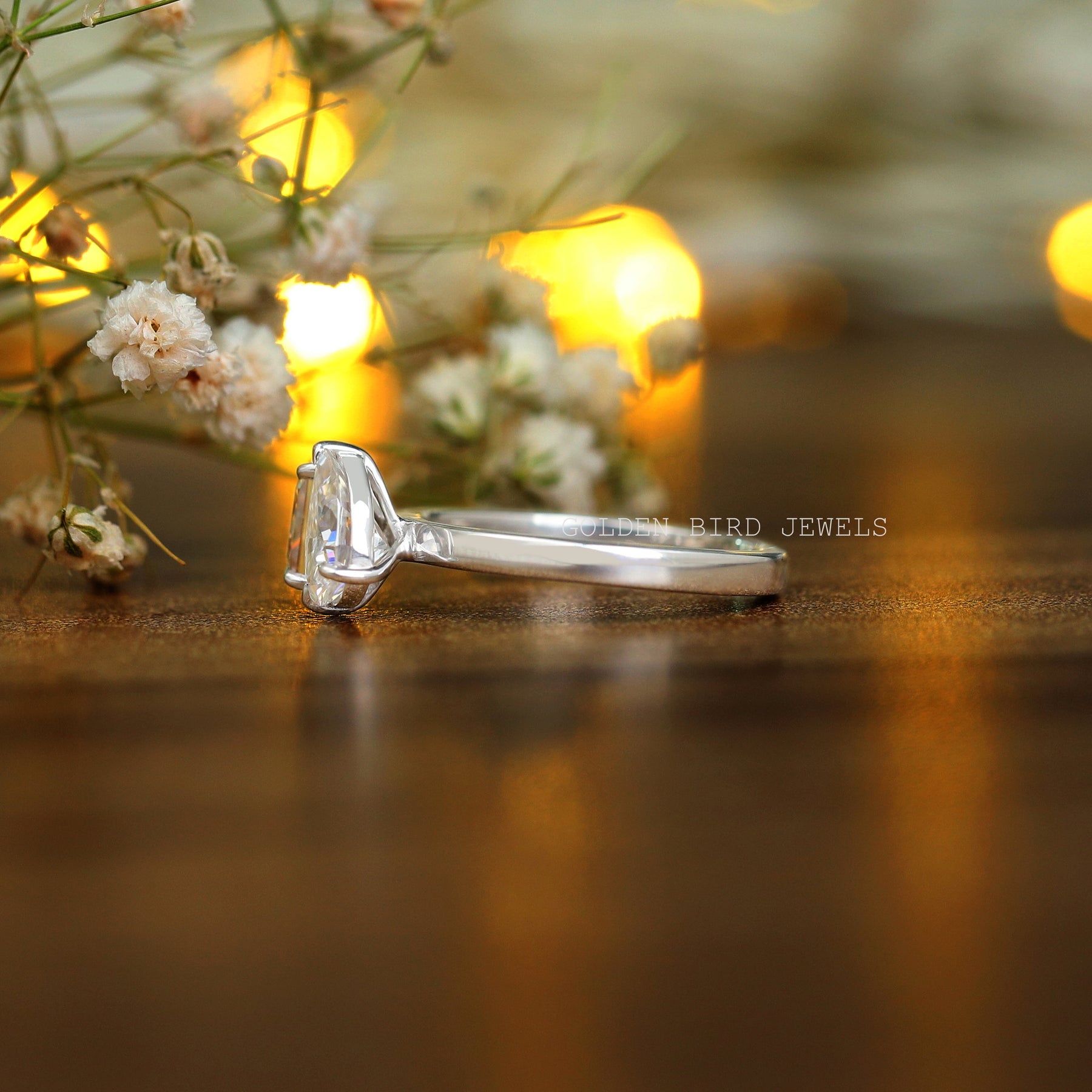 side view of a solitaire princess pear moissanite ring for women