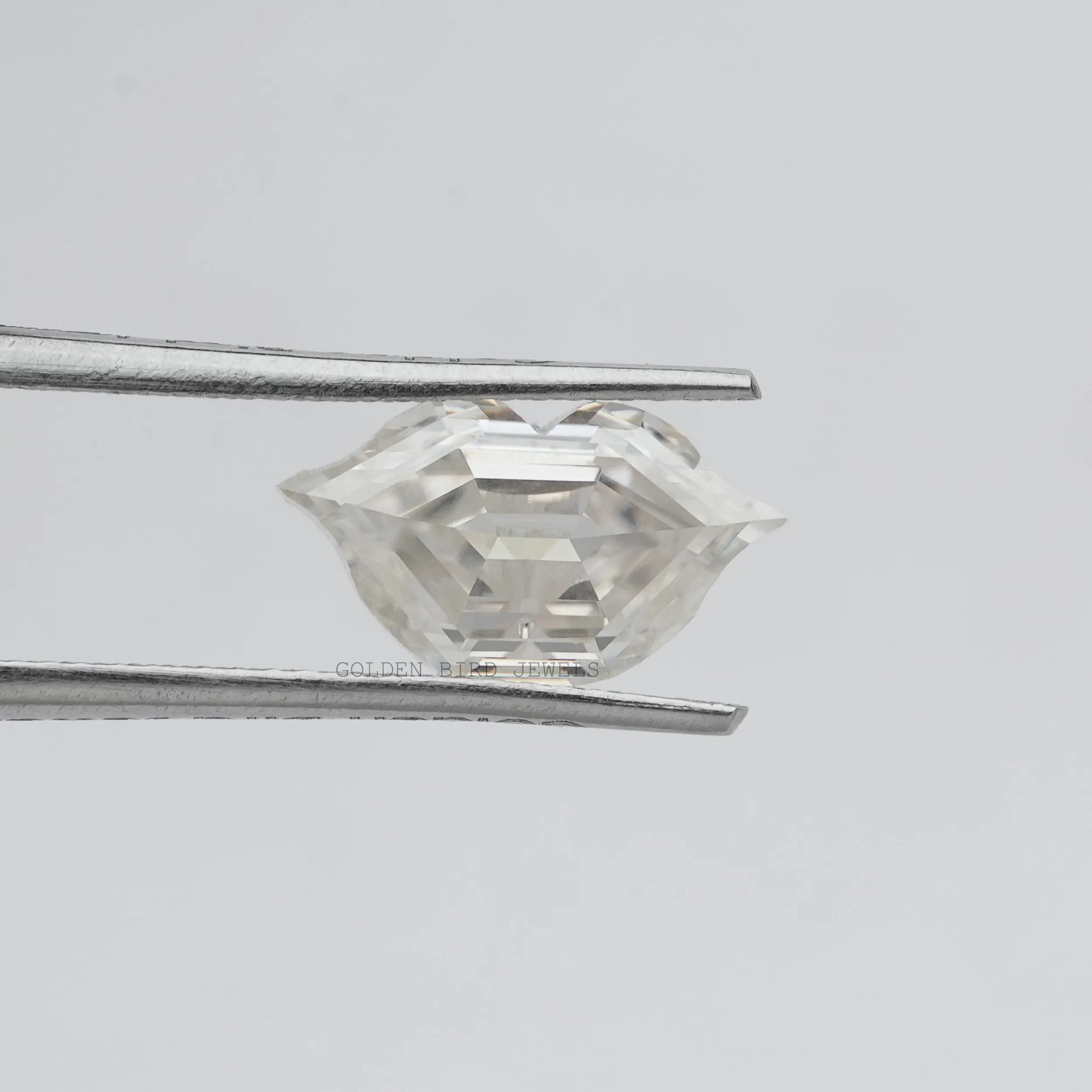 Tweezer holding the Lips Cut Moissanite Antique Loose Stone