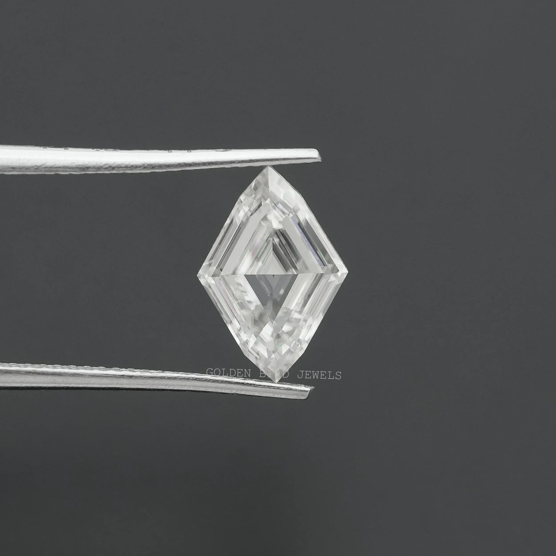 Front view of the Tweezers Holding Marquise Cut Antique Loose Moissanite In White