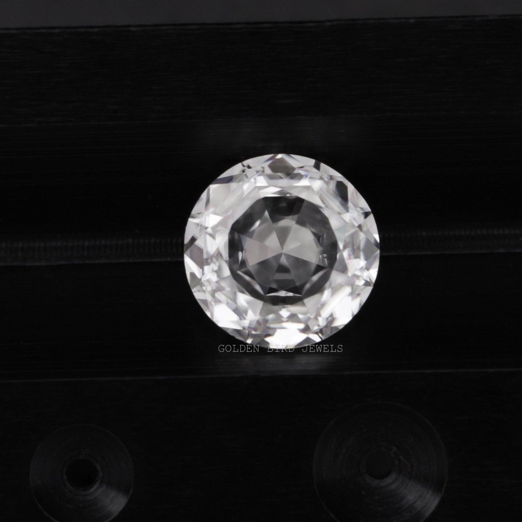 Detailed View Of Colorless Rose Cut Round Loose