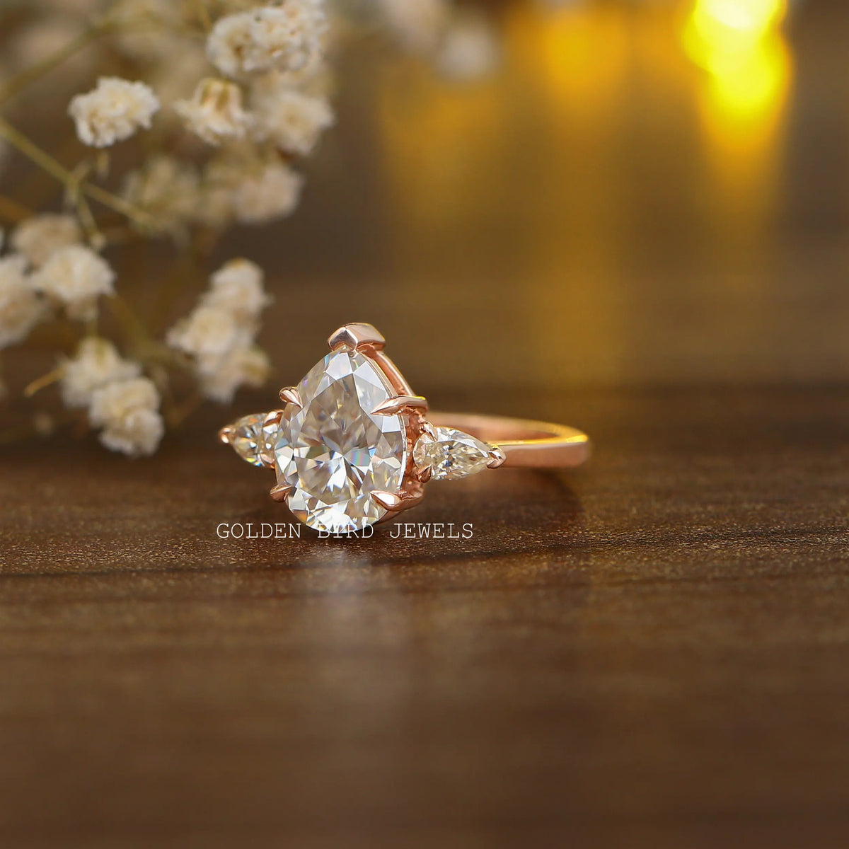 Front View of a pear-cut engagement ring in white gold