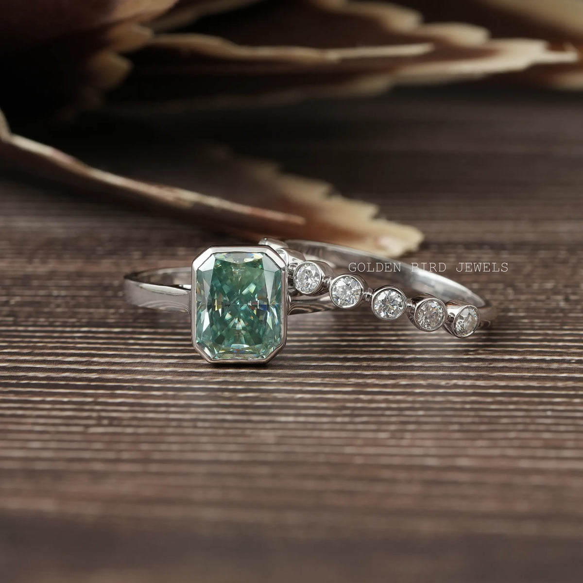 View of Radiant Cut Blue Moissanite Bezel Set Ring In White Gold