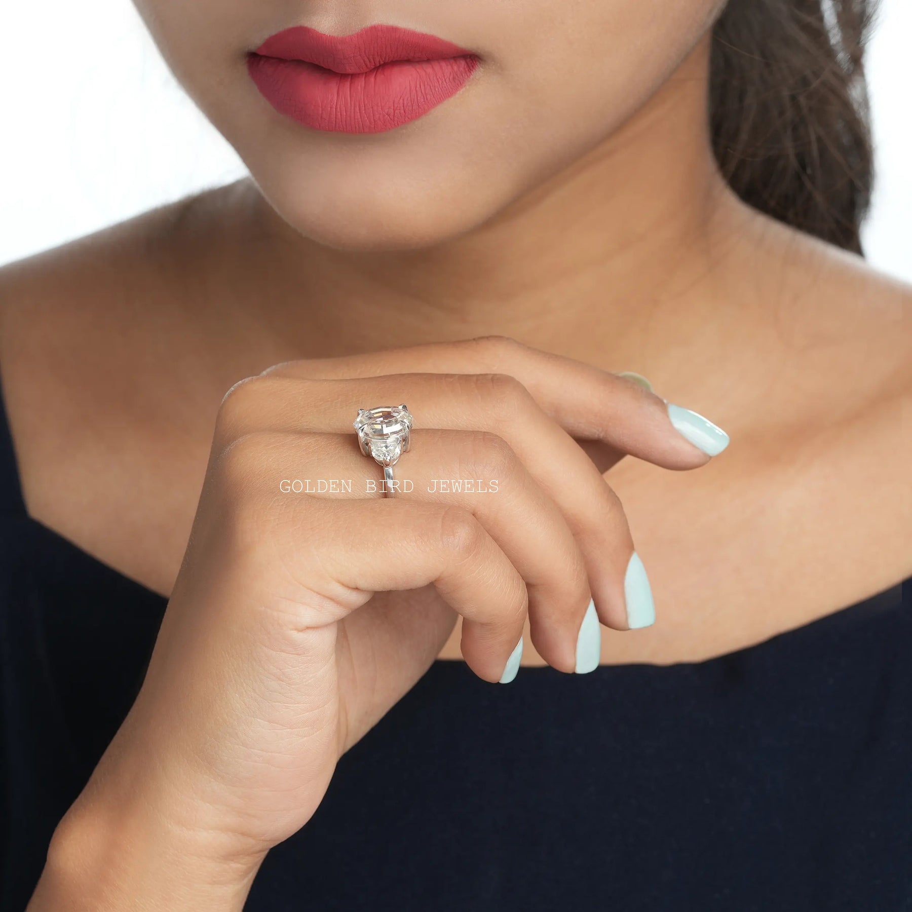 In a finger Side view of an oval cut moissanite ring