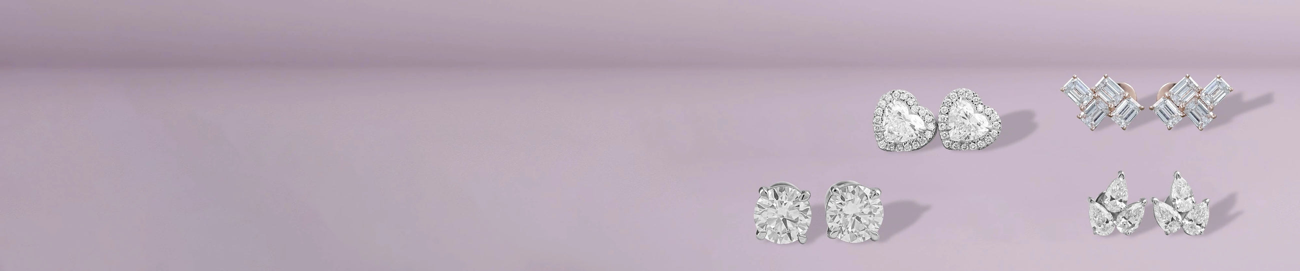 Lab grown diamond stud earrings in four prong setting on beige satin background