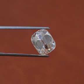 In Tweezer View Of 5.50 Carat Cushion Cut Loose Moissanite