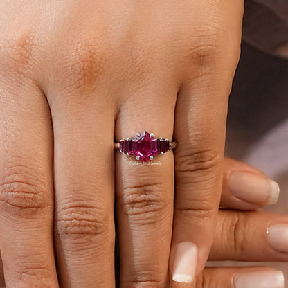 Five-stone ruby red gemstone ring with hexagon-cut center and prong-set side stones