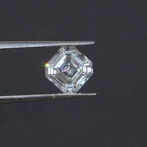 Tweezer holding the  Moissanite Asscher Cut Loose Stone