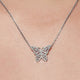 View of colorless butterfly round cut moissanite pendant 