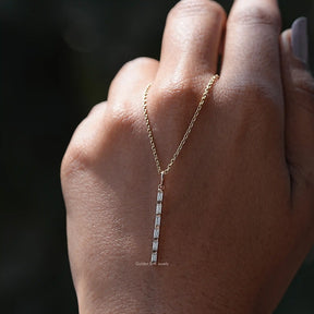 In hand showing view of moissanite pendant	 		
