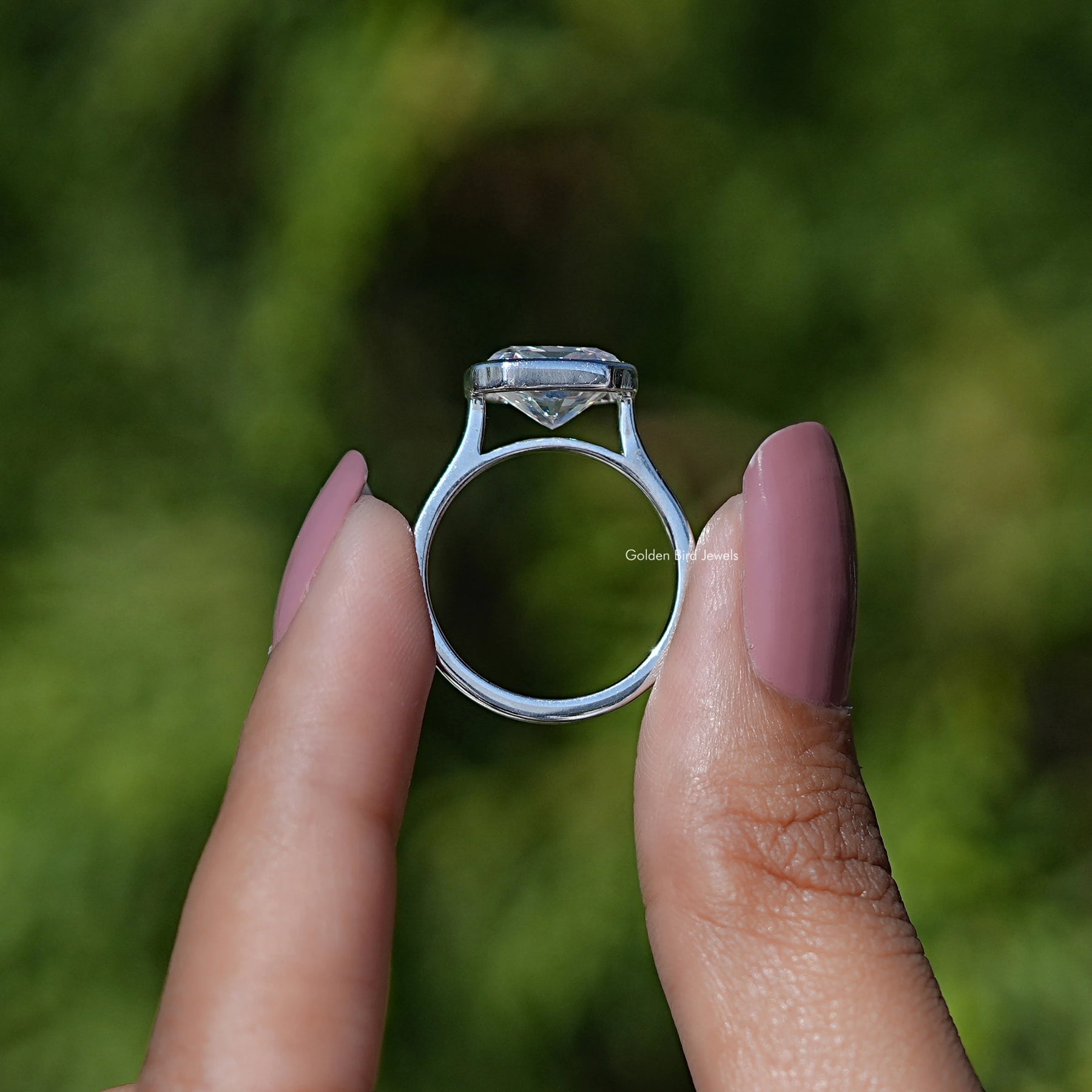 Back view of Radiant Cut Moissanite Solitaire Ring in secure setting 