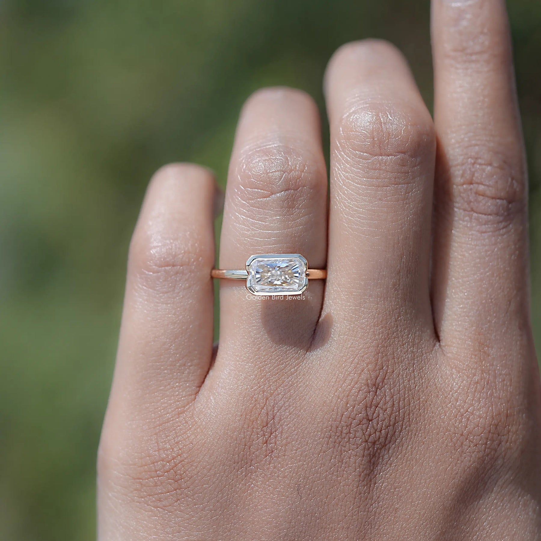 In finger view of Radiant Cut Moissanite Solitaire Ring