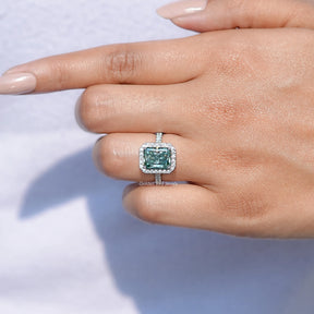 View of solitaire Blue Green Radiant Cut Moissanite ring in prongs setting 