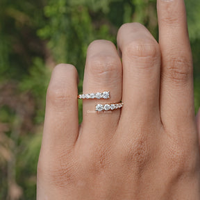 In finger front view of Moissanite Open Wrap Bypass Ring 