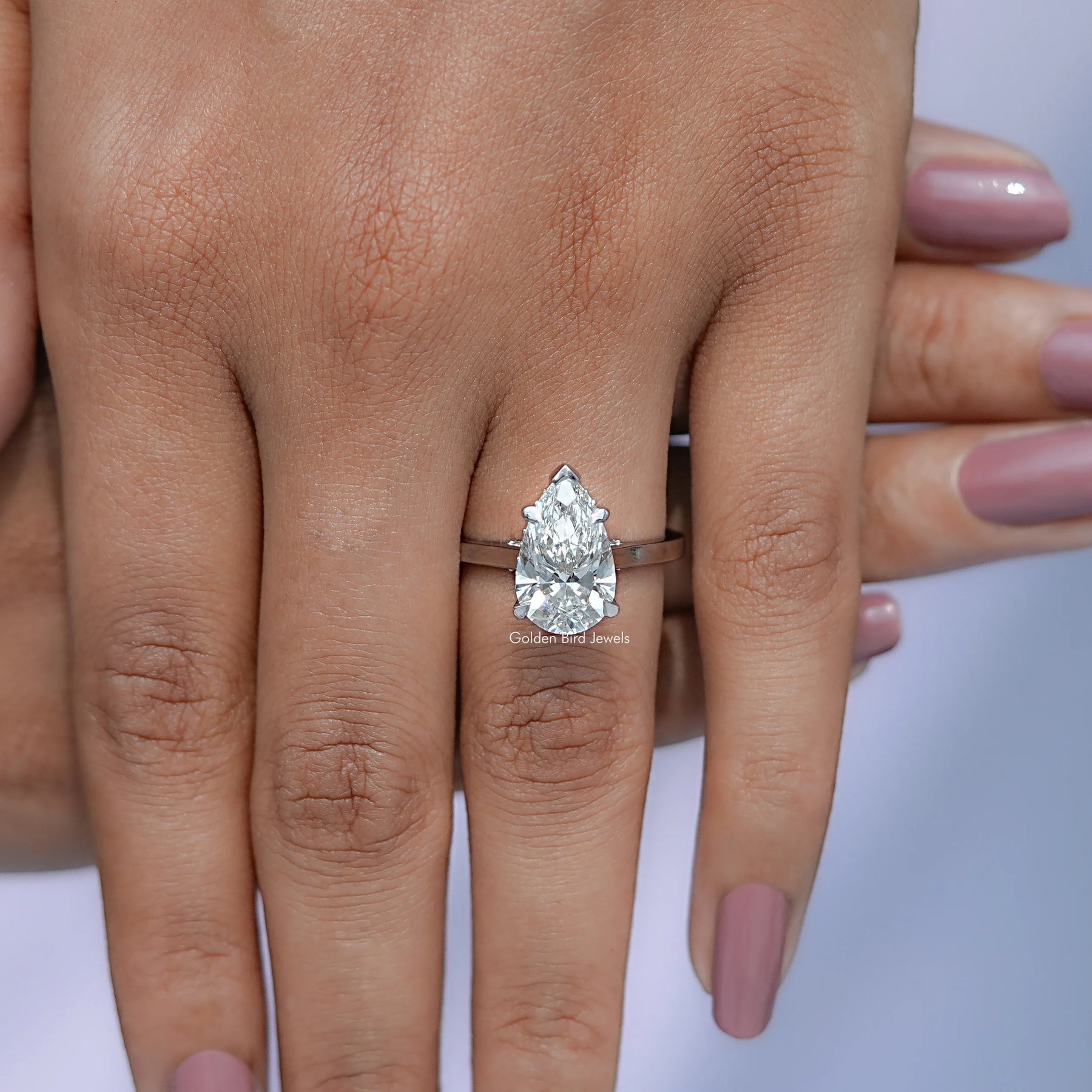 In hand Showing View Of Diamond Bridge Accent Wedding Ring 
