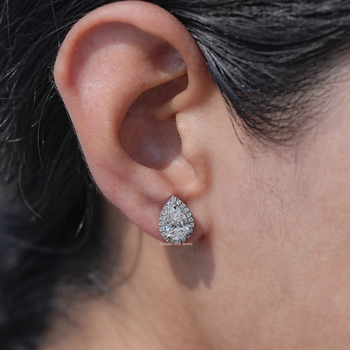 Ear's View of Pear Cut Diamond Halo Stud Earrings In White Gold