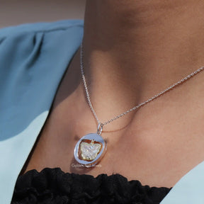 Side view of bezel set pendant In white Gold