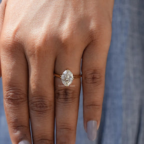 Detailed View Of Oval Cut Hidden Halo Moissanite Ring In Yellow Gold