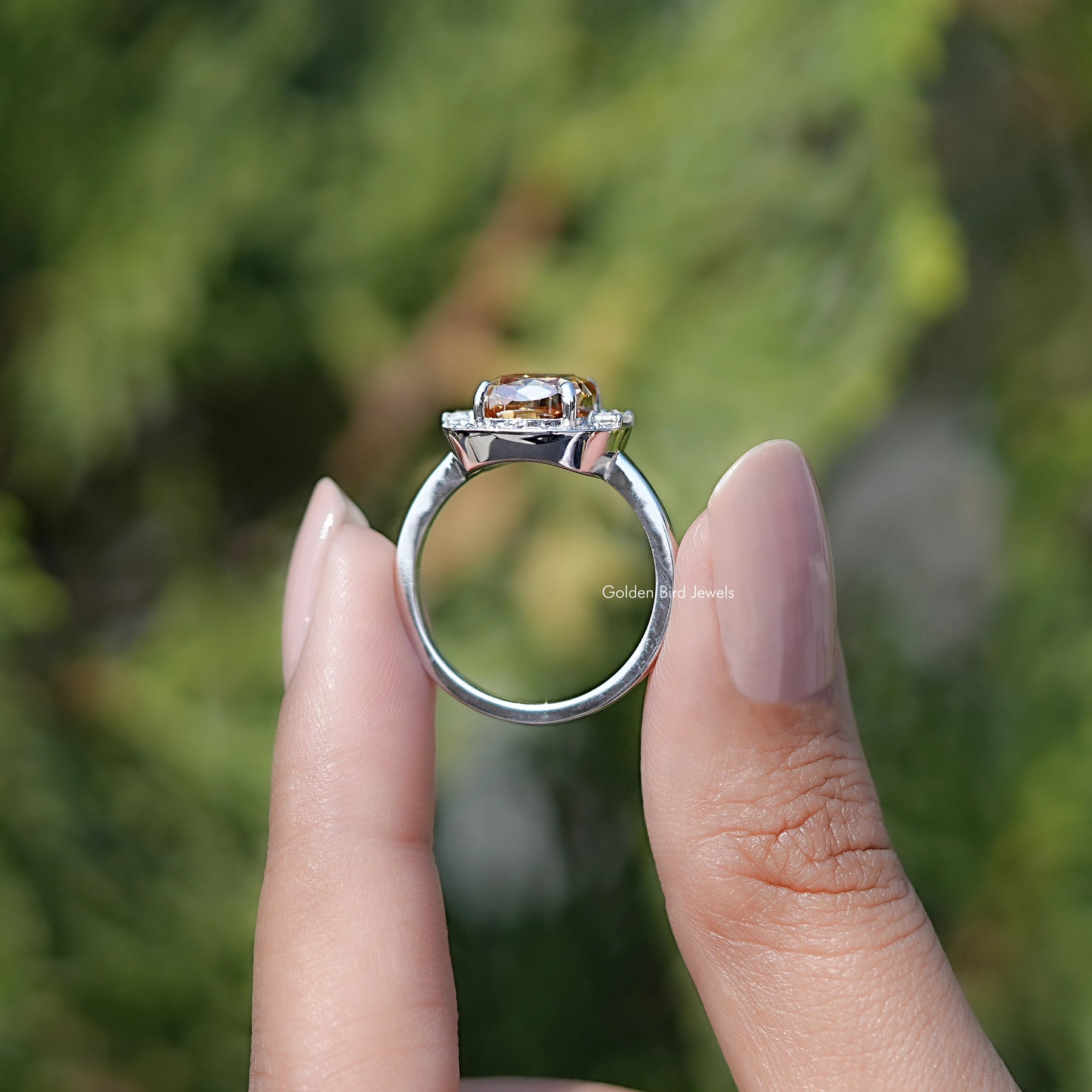 Back view of Criss Cut Cushion Moissanite Halo Engagement Ring in secure setting 

