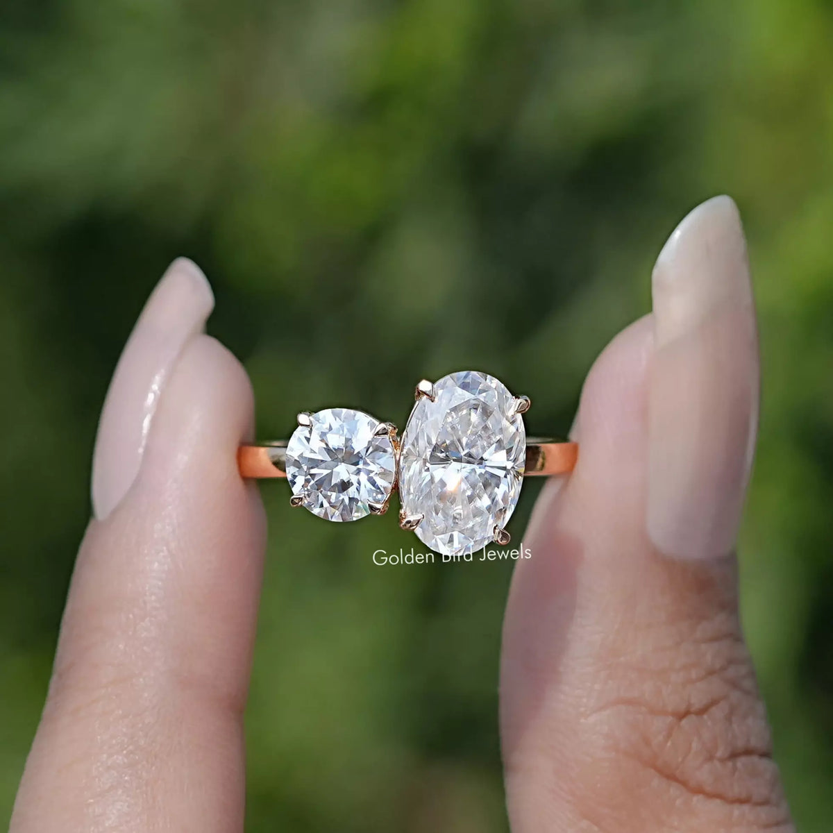 Front view of Crushed Ice Oval And Round Cut Moissanite Toi Et Moi Ring
