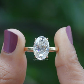 Front View of Oval Cut Solitaire Hidden Halo Ring In two Fingers