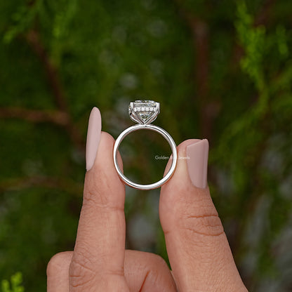 Solitaire ring front view showing silver band and cushion-cut stone in prong setting