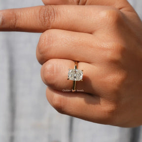 Close-Up View of Colorless Cushion Cut Moissanite Ring In Yellow Gold