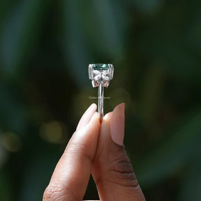 Side View of Cushion And Marquise Cut White Gold Ring In two fingers
