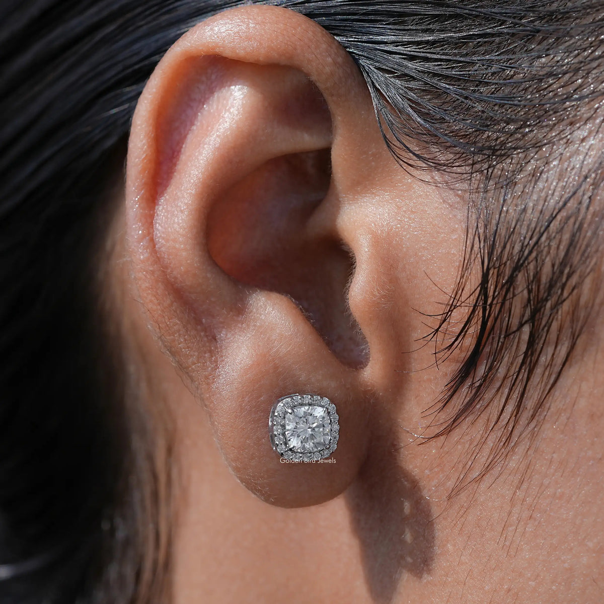 View of stud earrings crafted in side round moissanite 