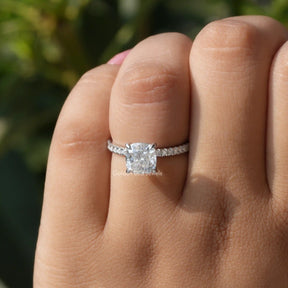 View of Cushion Cut Solitaire Accent Engagement Ring In Finger