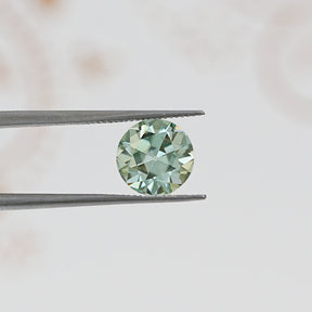 In Tweezer View Of Old European Round Cut Loose Moissanite
