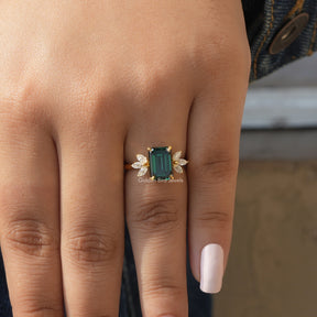 Close-Up View of Moissanite Emerald Cut Engagement Ring In Yellow Gold