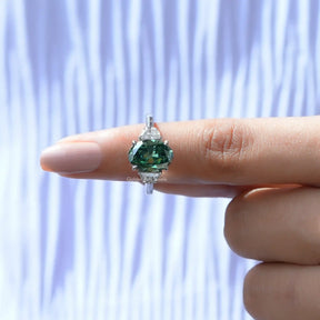 In finger front View of Oval Moissanite Three Stone Ring In White Gold