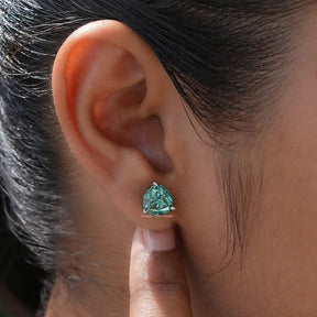 Close view of moissanite earrings in secure  setting  