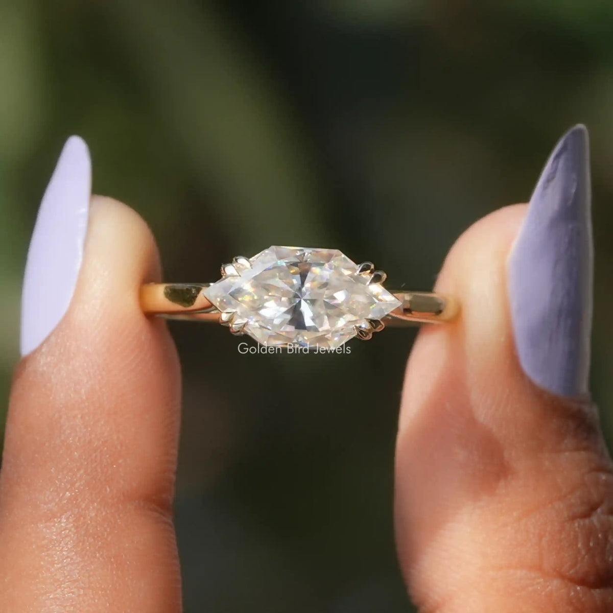 Front View of Dutch Marquise Solitaire Engagement Ring In two Fingers