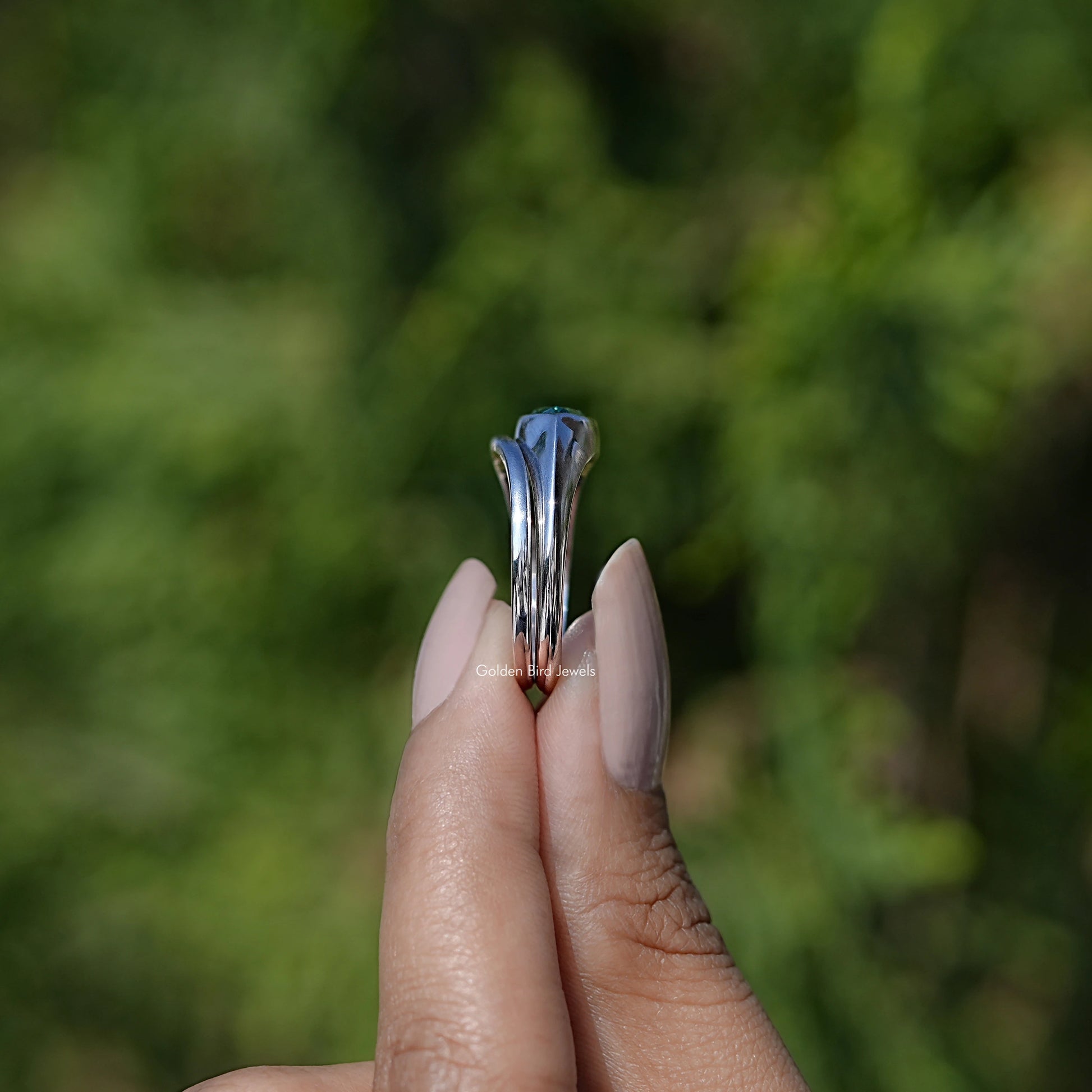 Side View of East West Green Marquise Bezel Set Moissanite Ring Set