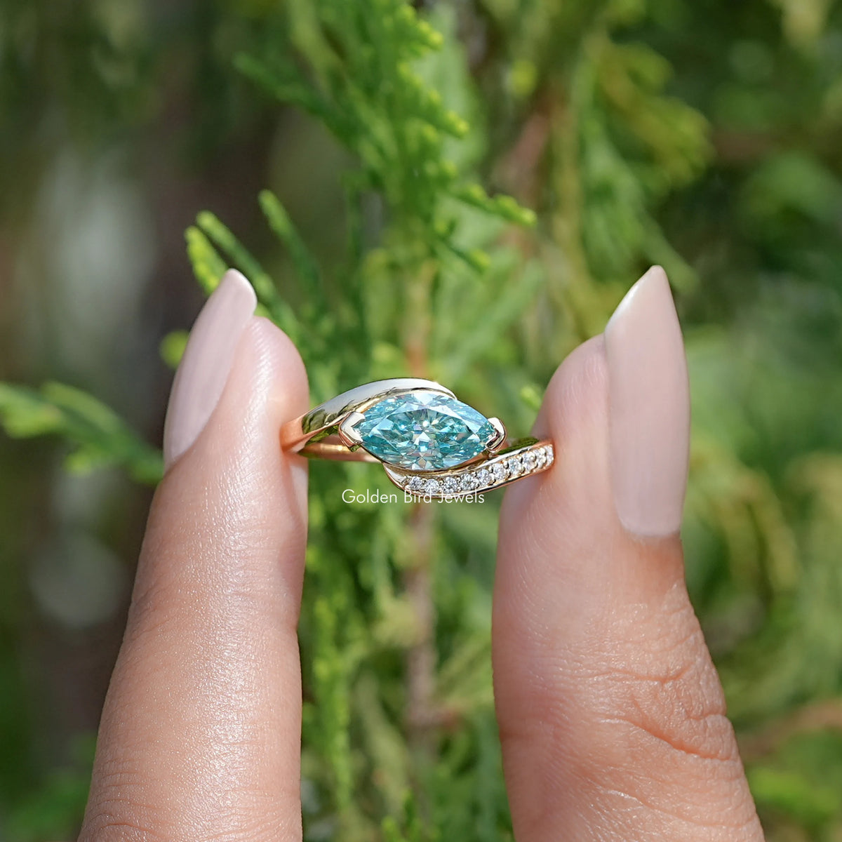 Front view of East West Blue Marquise Moissanite Bypass Ring