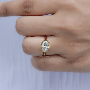 Detailed view of East West Oval Diamond Bezel Set Ring
