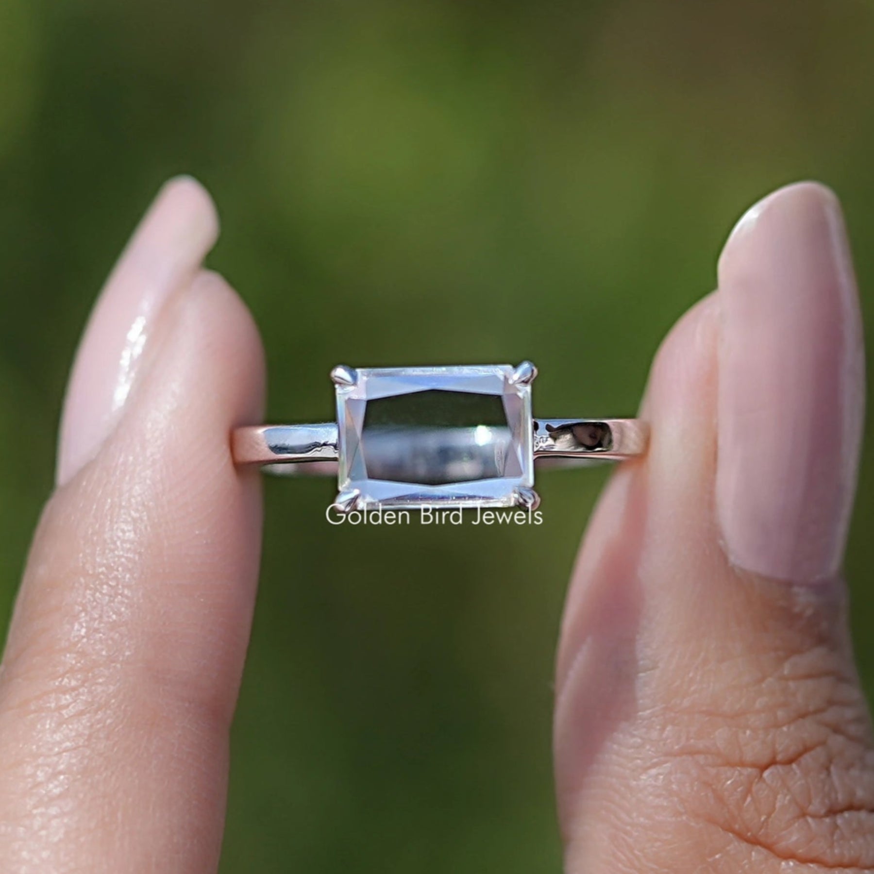 Front view of East West Portrait Radiant Moissanite Solitaire Ring