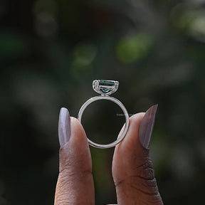 Back View of Radiant Cut Solitaire Engagement Ring In two fingers