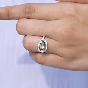 Rose Cut Pear Moissanite Halo Ring In finger